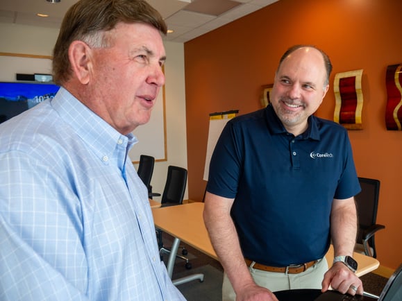 CoreTech president discussing with his team how to take client's IT support, security, and infrastructure to the next level